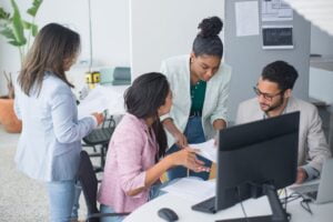 Supervisor discussing tasks with employees